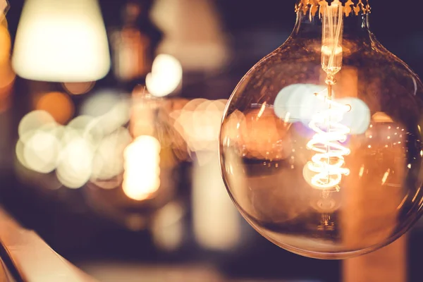 close up modern pendant light with vintage light bulb