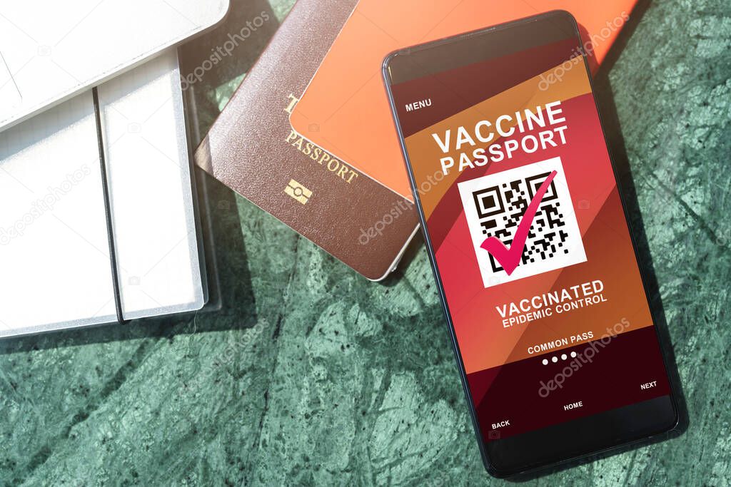 covid-19 vaccination certificate or vaccine passport for travellers concept. COVID-19 immunity e-passport in the smartphone mobile app for international travelling.