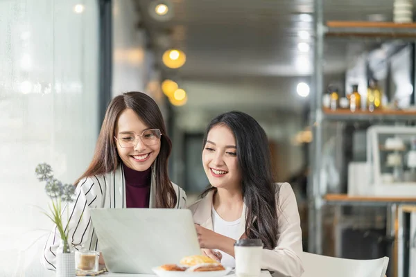 asian female creative agency casual meeting discussion working with laptop coffee work from home with client co worker,asian young woman with window and water rain drop raining background