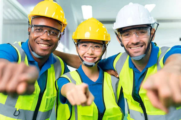 Close up portrait team of young multiethnic group male and female technician staff wearing a protective helmet. Happy teamwork laugh smile posing at camera smiling.
