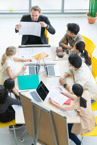 topview of creative agency business brain storm meeting presentation Team discussing roadmap to product launch, presentation, planning, strategy, new business development