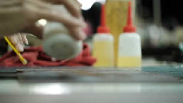 Close-Up Of Tailor Working On gluing and triming in leather work factory background — Stock Video