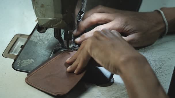 ( 영어 ) Close-Up of Tailor Working On Sewing Machine in leather factory background — 비디오