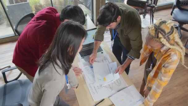 Meeting of UX developer and UI designer brainstorming about mobile app interface workflow design on table with coworker breif and color code at co-working space.Creative digital development agency. — Stock Video