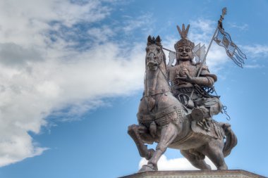 YUSHU(JYEKUNDO), CHINA - Jul 12 2014: King Gesar statue. a famous landmark in the Tibetan city of Yushu, Qinghai, China. clipart