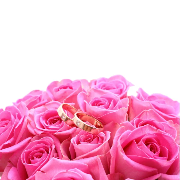 Set of wedding rings in pink rose taken closeup — Stock Photo, Image