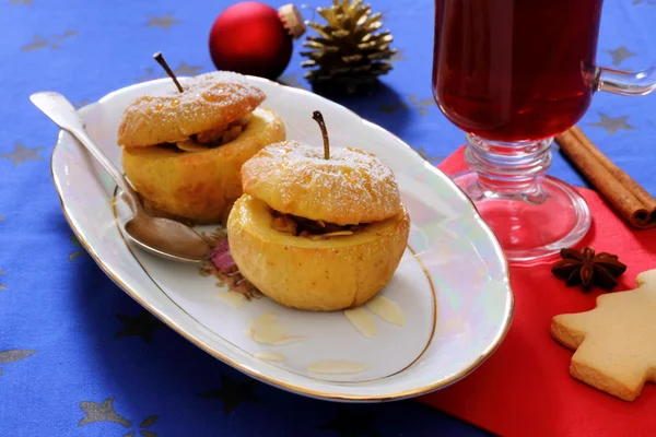 Baked apples as Christmas dessert and mulled wine — Stock Photo, Image