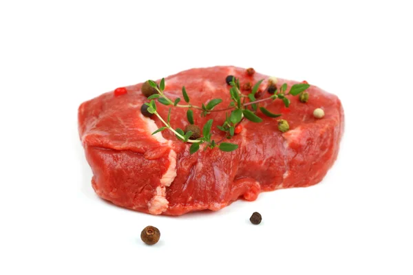 Juicy, raw beef steak with spices — Stock Photo, Image