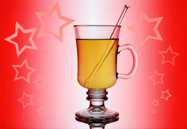 Yellow mulled wine on red background with stars — Stock Photo, Image