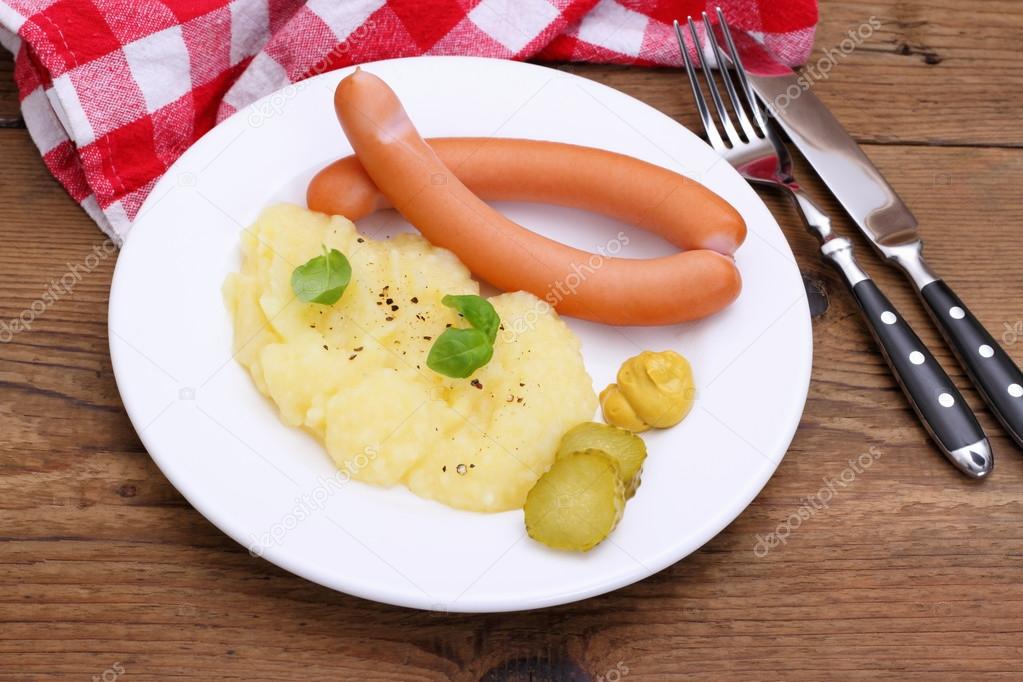 Pair of wiener sausage with mashed potatoes, mustard