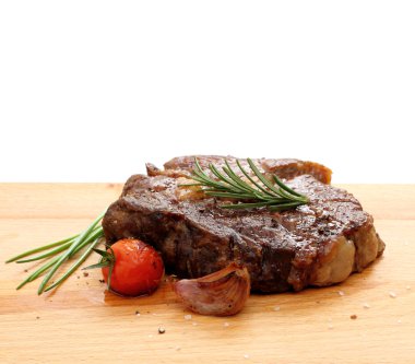 Steak rib-eye garnished with grilled clipart