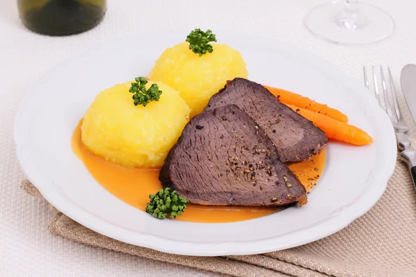 Beef roast with two dumplings in hunter sauce — Stock Photo, Image
