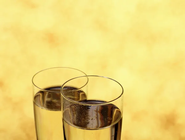 Two glasses with Champagne as wedding rings symbol — Stock Photo, Image