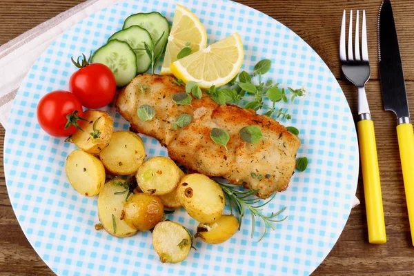 Fish fillet with rosemary potatoes, vegetables — Stock Photo, Image