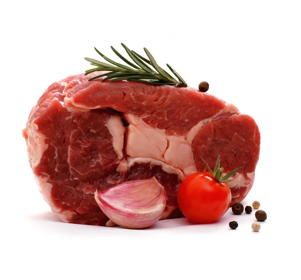 Huge raw ribeye steak garnished with spices — Stock Photo, Image