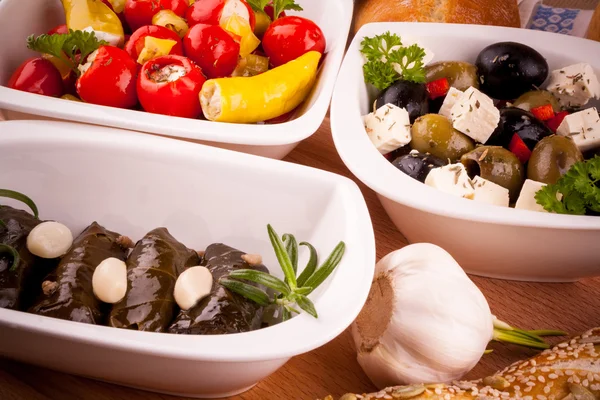 Mediterranean antipasto, vine leaves stuffed with peppers — Stock Photo, Image