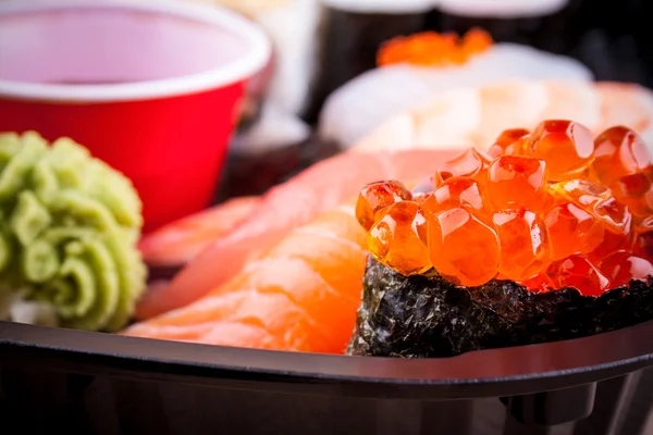 Salmon caviar ikura sushi with selective focus — ストック写真
