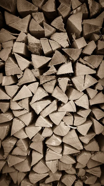 Neatly stacked wood as background, vertical — Stock Photo, Image