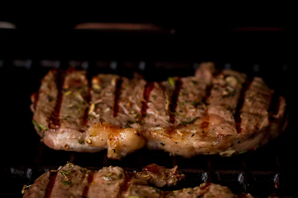 Two beef steak on gas grill — Stock Photo, Image