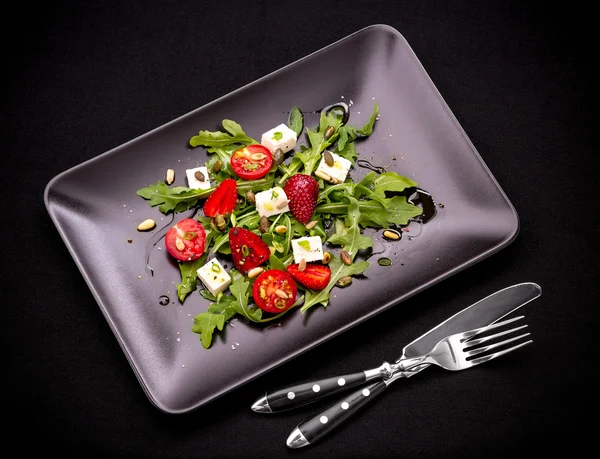 Strawberry tomato salad with feta cheese and cutlery — Stock Photo, Image