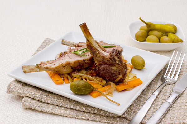 Grilled racks of lamb with olive and capers