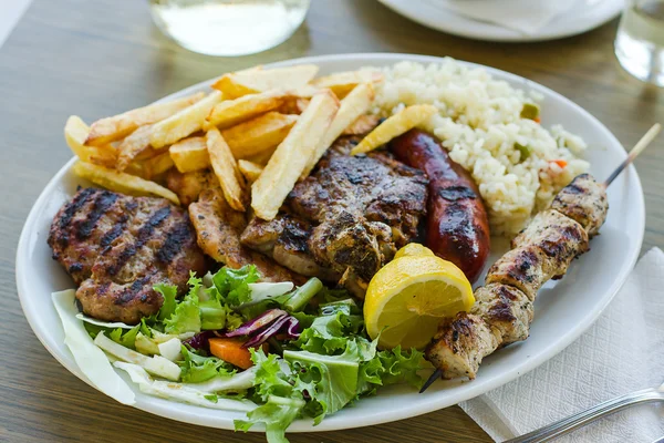 Mix meat plate with french fries — Stock Photo, Image