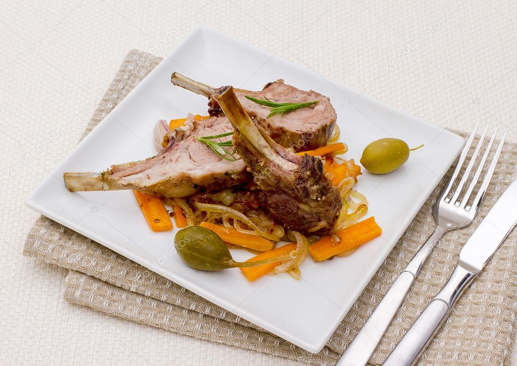 Grilled rack of lamb with olive, capers and carrot