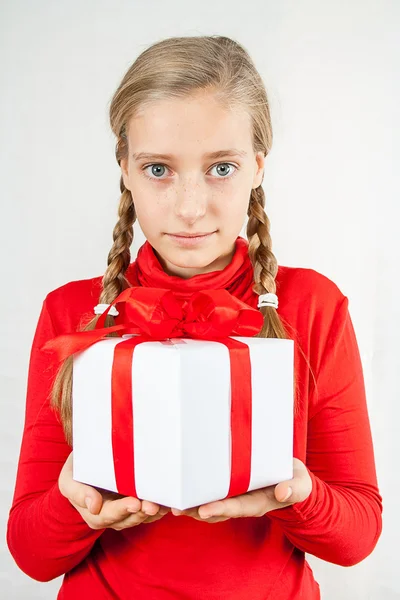 Cute blond girl in red with gift box — Stock Photo, Image