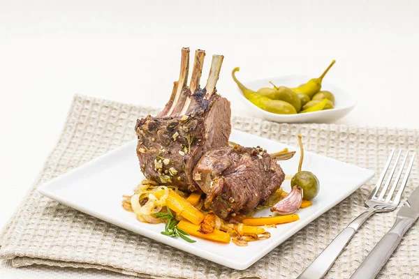 Grilled rack of lamb with carrot, garlic — Stock Photo, Image