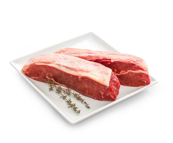 Fresh rump steaks with thymine twig — Stock Photo, Image