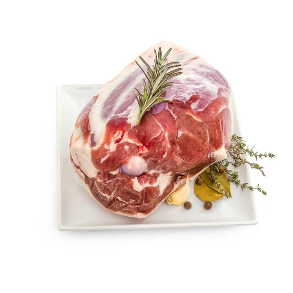 Raw lamb leg with bone, spices — Stock Photo, Image