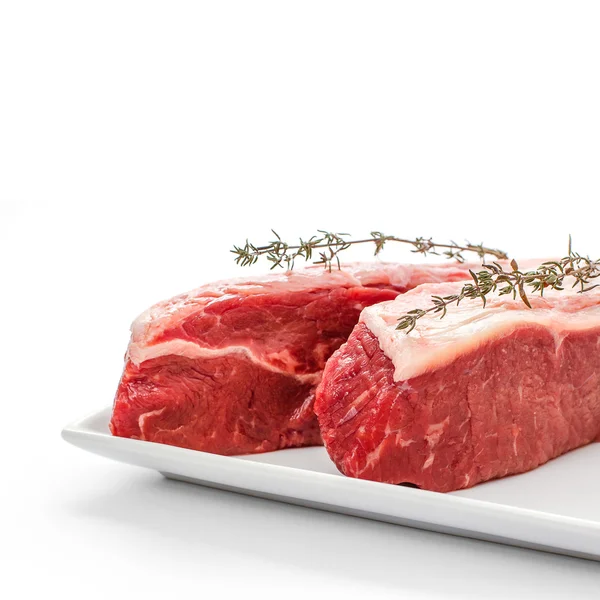Two fresh rump steaks with thymine twig — Stock Photo, Image
