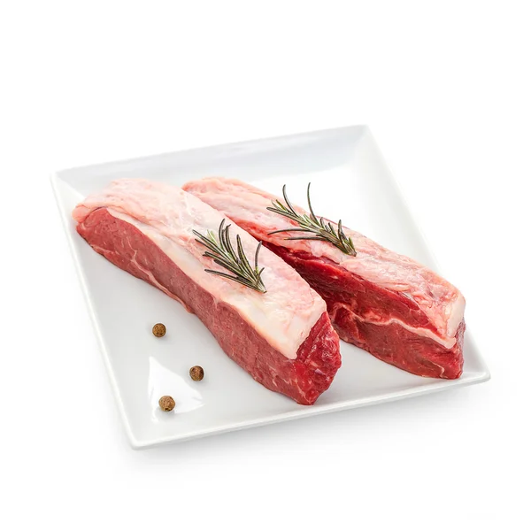 Fresh rump steaks with rosemary twig — Stock Photo, Image