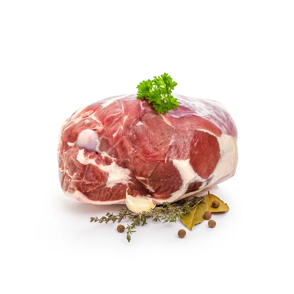 Raw lamb leg with bone, spices on white — Stock Photo, Image