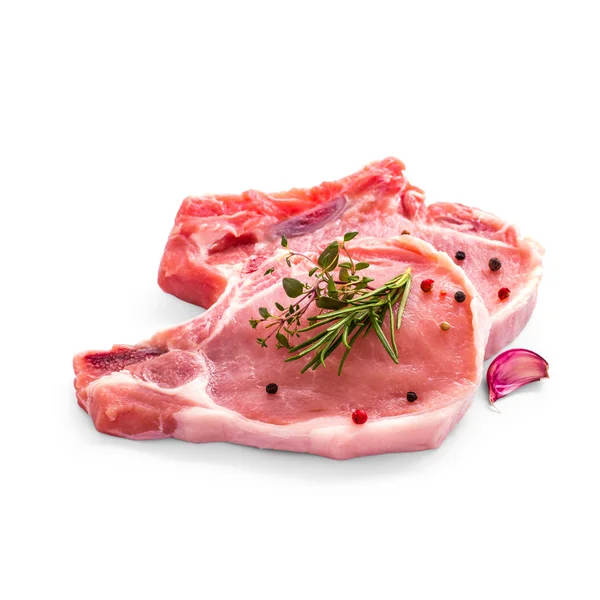 Twee sappige pork chop met kruiden geïsoleerd — Stockfoto