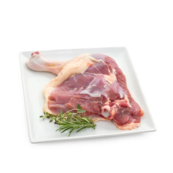 Barbarie duck leg with herbs on plate — Stock Photo, Image