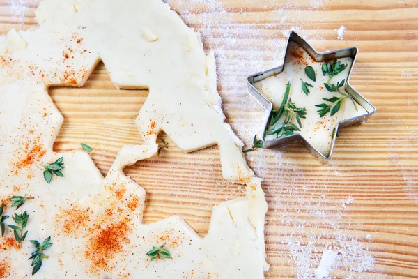 Cheese pastry dough with cookie cutters and shapes — Stock Photo, Image