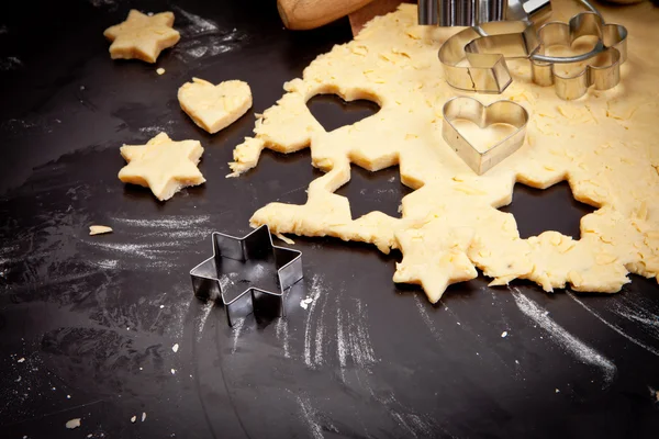 Cheese pastry dough with cookie cutters and shapes — Stock Photo, Image