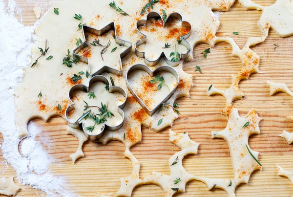 Cheese pastry dough with cookie cutters and shapes — Stock Photo, Image