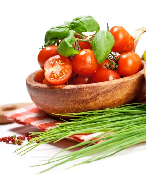 Cherry tomatoes and greens in bowl — Stock Photo, Image
