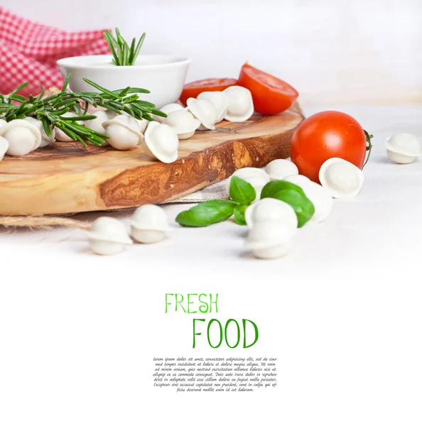 Tortellini and vegetables on white — Stock Photo, Image