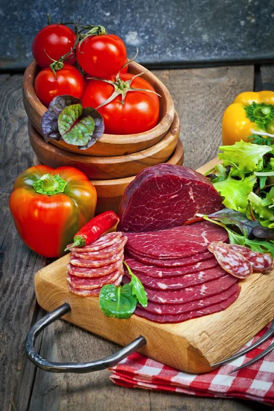 Delicious prosciutto and salami slices — Stock Photo, Image