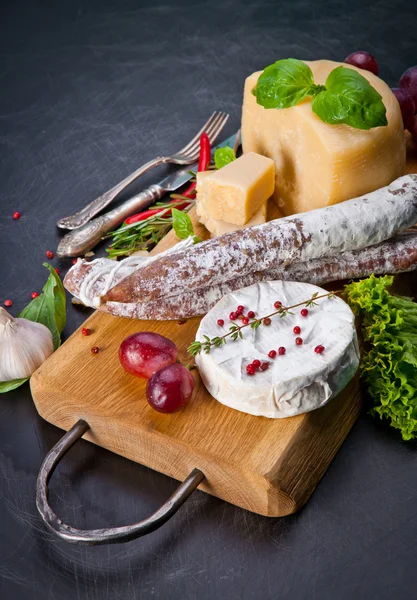 Various cheeses and salami — Stock Image Various cheeses and salami Royalty Free Stock Photos