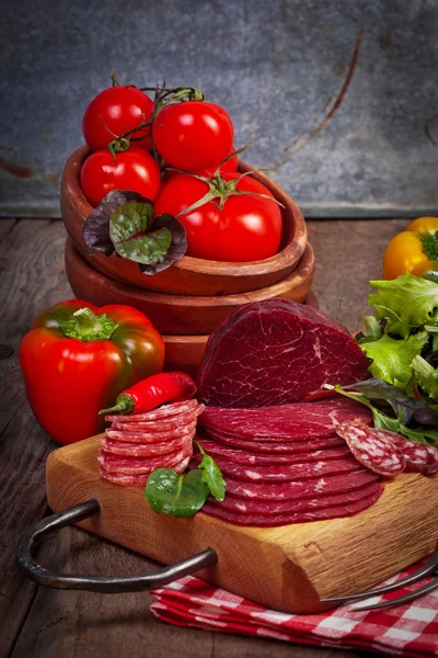Delicious prosciutto and salami slices — Stock Photo, Image