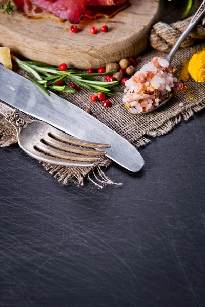 Herbs and spices in spoons — Stock Photo, Image