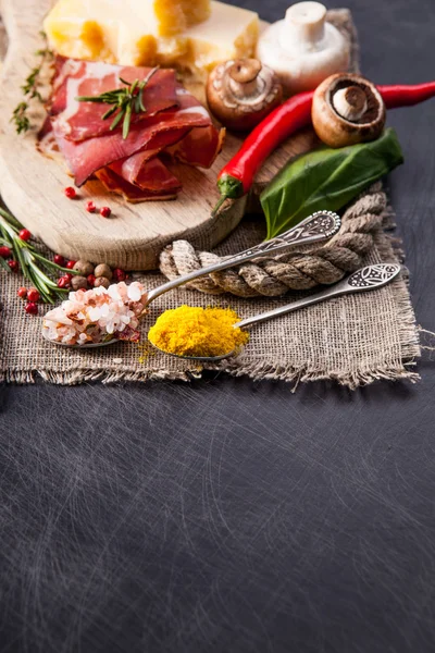 Cheeses, salami and mushrooms — Stock Photo, Image