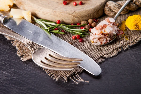 Herbs and spices in spoons — Stock Photo, Image