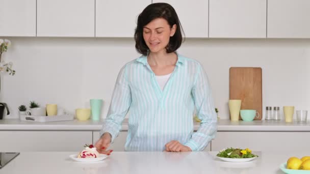 Brunette female choosing greens or baking — Wideo stockowe