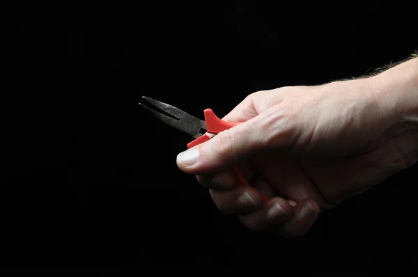 Pliers and a Hand — Stock Photo, Image