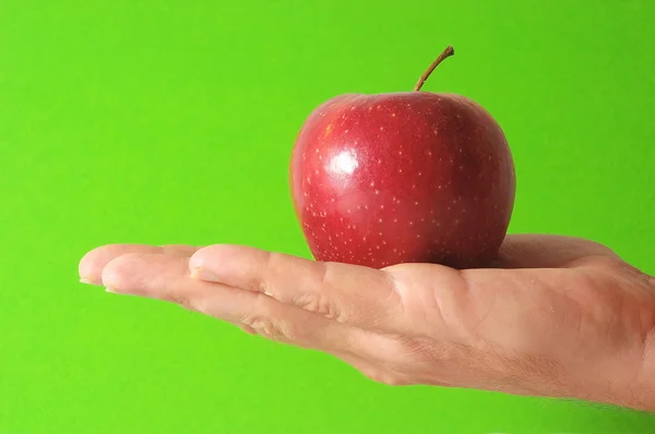 Apple op de hand — Stockfoto